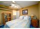 Bedroom includes bed, bookcase, side table and neutral colors at 2759 Beddington Way, Suwanee, GA 30024