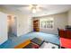 Bright bedroom featuring a ceiling fan, window, and closet at 2759 Beddington Way, Suwanee, GA 30024