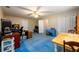 Spacious bedroom with blue carpet, a ceiling fan, closet, and natural light at 2759 Beddington Way, Suwanee, GA 30024