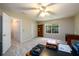 Spacious bedroom with a large window, a ceiling fan, and a closet at 2759 Beddington Way, Suwanee, GA 30024