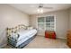 Bright bedroom featuring neutral walls, a ceiling fan, and a window offering natural light at 2759 Beddington Way, Suwanee, GA 30024