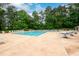 A sparkling pool with ample lounge chairs and tables, ideal for relaxation and socializing at 2759 Beddington Way, Suwanee, GA 30024