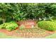 Attractive Berkshire neighborhood sign surrounded by lush landscaping and colorful flowers at 2759 Beddington Way, Suwanee, GA 30024