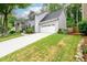 A beautiful two-story home is complete with a two-car garage and meticulously manicured lawn at 2759 Beddington Way, Suwanee, GA 30024