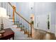 Bright foyer with hardwood floors, a staircase, and a view of the front door at 2759 Beddington Way, Suwanee, GA 30024