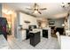 Well-equipped kitchen with granite countertops, white cabinets, and a central island at 2759 Beddington Way, Suwanee, GA 30024