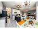 Open kitchen with granite countertops and a breakfast nook leading into the living room at 2759 Beddington Way, Suwanee, GA 30024