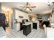 Spacious kitchen featuring white cabinets, granite countertops, and an open view to the living room at 2759 Beddington Way, Suwanee, GA 30024