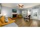 Spacious living room with a fireplace, ample seating, and hardwood flooring at 2759 Beddington Way, Suwanee, GA 30024