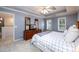 Comfortable main bedroom with neutral decor and tray ceiling at 2759 Beddington Way, Suwanee, GA 30024