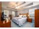 Comfortable main bedroom with trey ceilings, ceiling fan, and natural light at 2759 Beddington Way, Suwanee, GA 30024