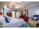 Primary bedroom with tray ceiling and a large closet space at 2759 Beddington Way, Suwanee, GA 30024