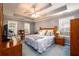 Spacious bedroom with tray ceiling and ensuite bathroom at 2759 Beddington Way, Suwanee, GA 30024