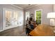 Bright office with wood floors, french doors, and natural light streaming through large windows at 2759 Beddington Way, Suwanee, GA 30024