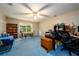 Spacious home office includes desk area, shelves, a window, and a blue carpet at 2759 Beddington Way, Suwanee, GA 30024