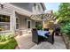 Back patio with table, chairs, and shade umbrella at 2759 Beddington Way, Suwanee, GA 30024
