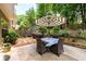 Cozy patio with outdoor seating under a striped umbrella at 2759 Beddington Way, Suwanee, GA 30024