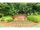 An attractive neighborhood entrance sign is surrounded by beautiful landscaping at 2759 Beddington Way, Suwanee, GA 30024