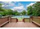 Well-maintained tennis courts with a wooden deck offering views of the game at 2759 Beddington Way, Suwanee, GA 30024