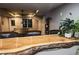 Basement bar area with live edge wooden counter, seating, and pool table at 308 Forkwood Trl, Woodstock, GA 30189