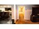 Finished basement with bar area, TV, and view into another room with white cabinets at 308 Forkwood Trl, Woodstock, GA 30189