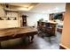 Finished basement featuring a pool table, bar area, and dark wood flooring at 308 Forkwood Trl, Woodstock, GA 30189