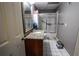 Bathroom features a granite countertop, white tiled flooring, and a glass enclosed shower at 308 Forkwood Trl, Woodstock, GA 30189