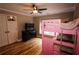 Bedroom with hardwood floors, a pink bunk bed, and a dresser at 308 Forkwood Trl, Woodstock, GA 30189