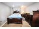 Basement bedroom with hardwood flooring, queen sized bed, and dresser at 308 Forkwood Trl, Woodstock, GA 30189