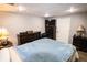 Basement bedroom with hardwood floors, full sized bed, and natural light at 308 Forkwood Trl, Woodstock, GA 30189