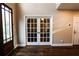 Entryway showcases glass paneled doors and hardwood floors at 308 Forkwood Trl, Woodstock, GA 30189