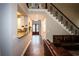 Hallway featuring hardwood floors and stairs with iron railing at 308 Forkwood Trl, Woodstock, GA 30189