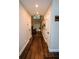 Hallway with hardwood floors leading to a living area at 308 Forkwood Trl, Woodstock, GA 30189