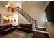 Living room features hardwood floors and a staircase with iron railing at 308 Forkwood Trl, Woodstock, GA 30189