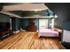 Large primary bedroom featuring hardwood floors, vaulted ceilings, and plenty of space at 308 Forkwood Trl, Woodstock, GA 30189