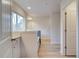 A hallway view to a bathroom with a dual vanity and a window at 327 Tulip Dr, Covington, GA 30016
