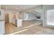 Open-concept living space featuring a modern kitchen, a spacious living area, and hardwood floors at 327 Tulip Dr, Covington, GA 30016