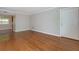 Living room featuring polished hardwood floors, neutral walls, natural light, and a white trim at 100 Biscayne Nw Dr # D7, Atlanta, GA 30309