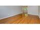 Spacious living room featuring polished hardwood floors, neutral walls, and natural light at 100 Biscayne Nw Dr # D7, Atlanta, GA 30309