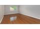 Living room featuring polished hardwood floors, neutral walls, natural light, and a white trim at 100 Biscayne Nw Dr # D7, Atlanta, GA 30309