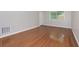 Living room featuring polished hardwood floors, neutral walls, natural light, and a white trim at 100 Biscayne Nw Dr # D7, Atlanta, GA 30309