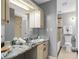 Gray bathroom with a marble countertop and vanity at 1127 Riverbend Club Se Dr, Atlanta, GA 30339