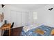 Bedroom with hardwood floors and large closet at 1127 Riverbend Club Se Dr, Atlanta, GA 30339