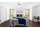 Bright bedroom with hardwood floors, neutral paint, and large windows offering great views at 1127 Riverbend Club Se Dr, Atlanta, GA 30339