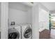 Laundry room featuring a modern washer and dryer at 1127 Riverbend Club Se Dr, Atlanta, GA 30339