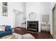 Cozy living room featuring a fireplace, hardwood floors, and modern decor at 1127 Riverbend Club Se Dr, Atlanta, GA 30339