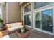 Inviting outdoor patio with comfortable seating and glass doors providing seamless indoor-outdoor living at 1127 Riverbend Club Se Dr, Atlanta, GA 30339