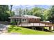 A well-maintained deck offers a serene spot for outdoor lounging and entertainment in a private backyard setting at 2044 Wilandrew Dr, Decatur, GA 30033