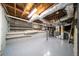 Unfinished basement with exposed ductwork, concrete floor, and shelving units, ready for customization at 2044 Wilandrew Dr, Decatur, GA 30033