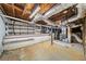 Unfinished basement, showcasing the potential for customization and added storage with lots of pipes at 2044 Wilandrew Dr, Decatur, GA 30033